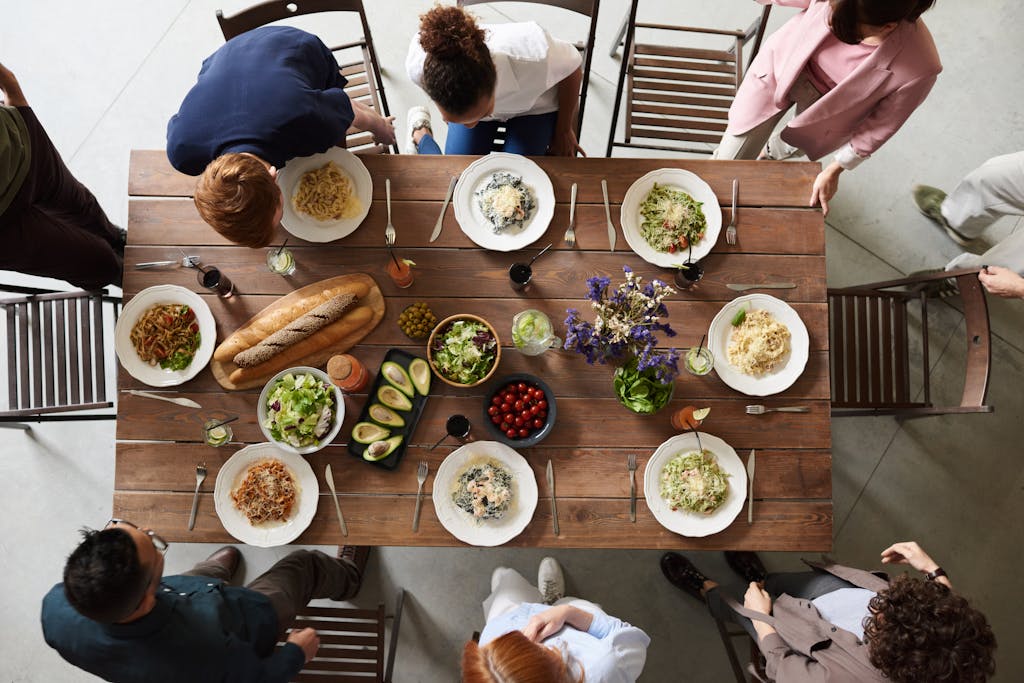 A family enjoying a screen-free dinner, engaging in meaningful conversation and reconnecting without the distraction of technology.